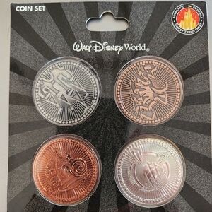 Walt Disney World exclusive Theme Park Icons 4 Coin Set..NEW in park packaging.